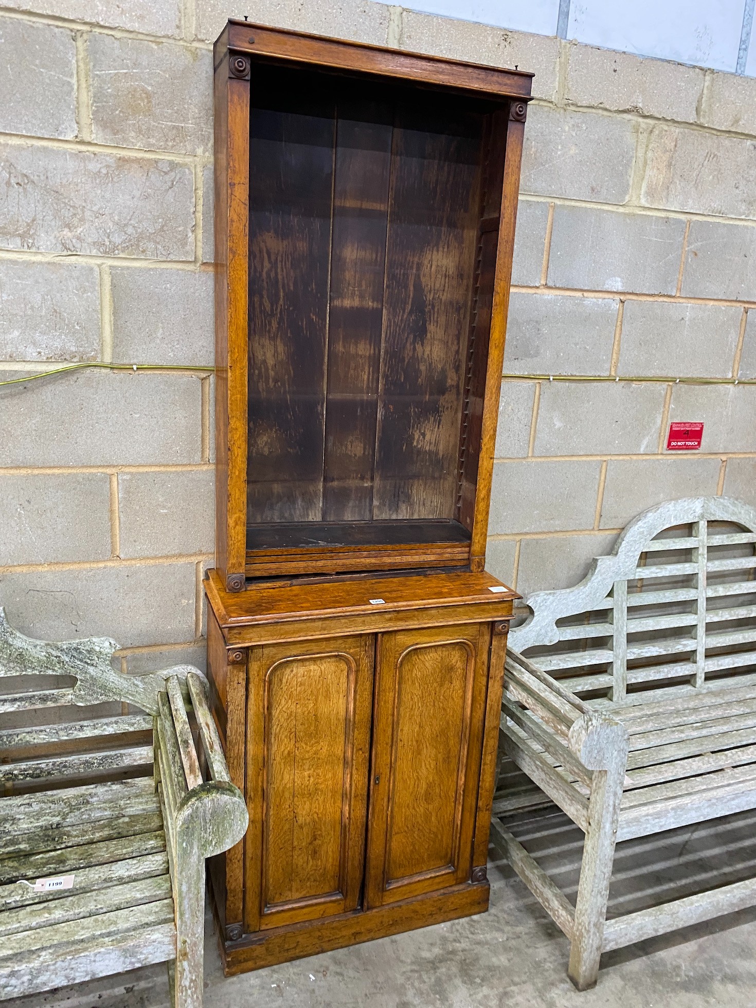 A Victorian narrow oak bookcase cupboard, width 72cm, depth 34cm, height 208cm